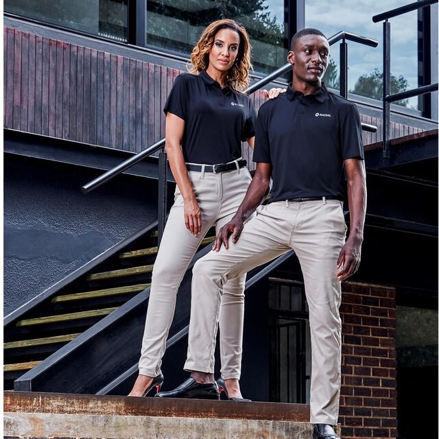 Two colleagues in branded golf shirts